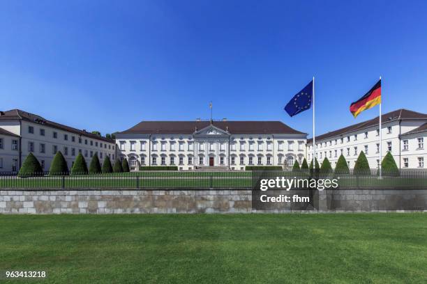 schloss bellevue wih german and eu-flag (bellevue castle) - berlin, germany - bellevue skyline stock-fotos und bilder