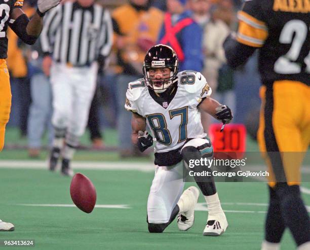 Wide receiver Keenan McCardell of the Jacksonville Jaguars celebrates after catching a pass for a first down by spinning the football during a game...