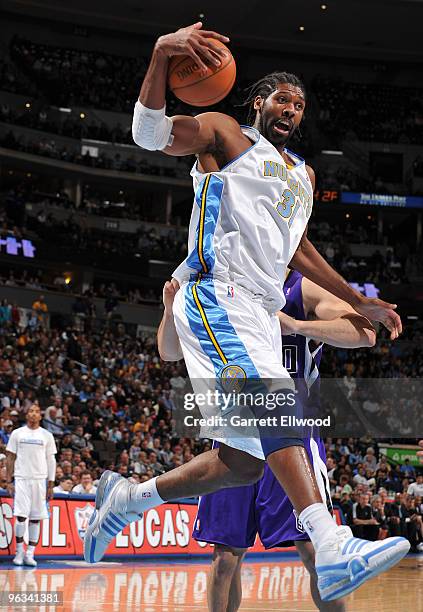 Nene of the Denver Nuggets pulls down a rebound against the Sacramento Kings on February 1, 2010 at the Pepsi Center in Denver, Colorado. NOTE TO...
