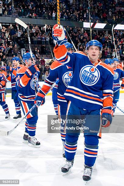 Robert Nilsson of the Edmonton Oilers and his teammates salute the crowd after finally stopping their 13-game losing streak, the came came against...