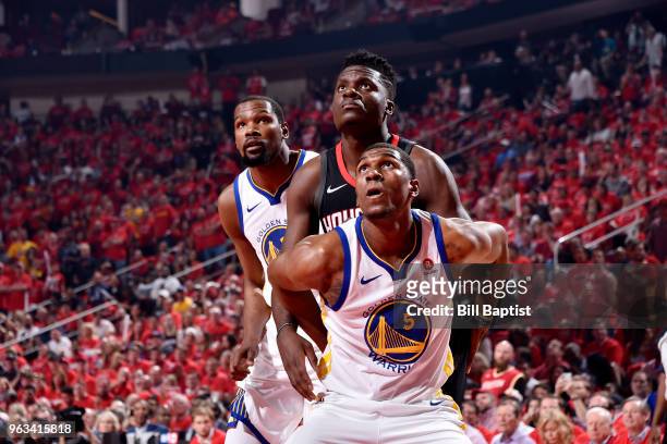 Kevon Looney of the Golden State Warriors boxes out Clint Capela of the Houston Rockets in Game Seven of the Western Conference Finals during the...
