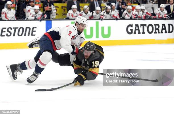 Reilly Smith of the Vegas Golden Knights is checked by Matt Niskanen of the Washington Capitals during the first period during the first period in...