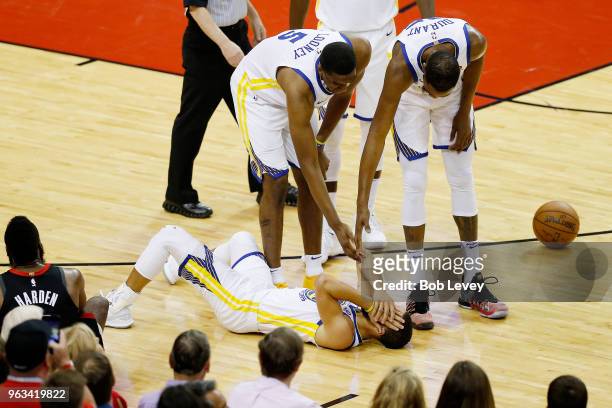 Stephen Curry of the Golden State Warriors reacts to contact in the first quarter of Game Seven of the Western Conference Finals of the 2018 NBA...