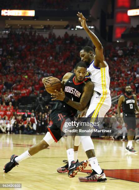 Trevor Ariza of the Houston Rockets drives against Kevin Durant of the Golden State Warriors In the first half of Game Seven of the Western...