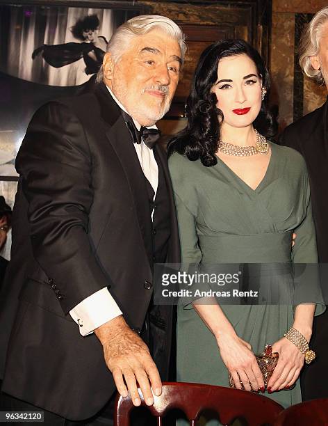 Mario Adorf and Dita von Teese attend the Lambertz Monday Night Schoko & Fashion party at the Alten Wartesaal on February 1, 2010 in Cologne, Germany.