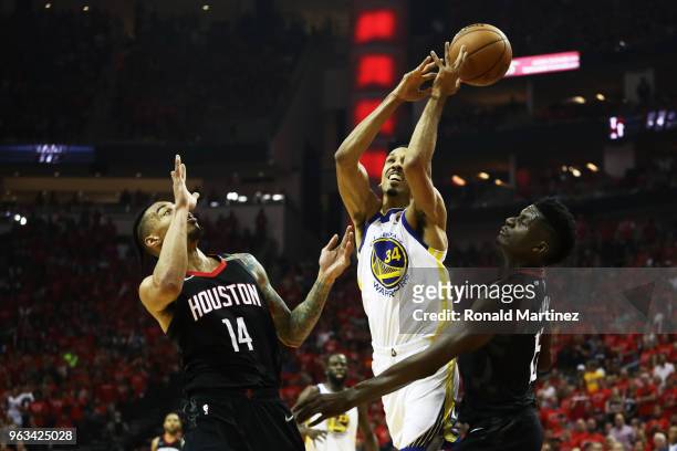 Shaun Livingston of the Golden State Warriors rebounds against Gerald Green and Clint Capela of the Houston Rockets in the first half of Game Seven...