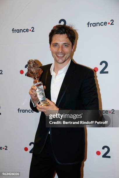 Raphael Personnaz poses with his Moliere for Best One Man Show during the "Ceremonie des Molieres 2018" at Salle Pleyel on May 28, 2018 in Paris,...