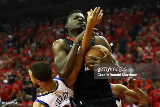 Clint Capela of the Houston Rockets goes up against Stephen Curry of the Golden State Warriors in the second quarter of Game Seven of the Western...