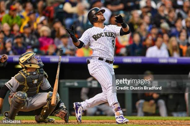 Gerardo Parra of the Colorado Rockies reacts after popping out to end the sixth inning of a game against the San Francisco Giants at Coors Field on...