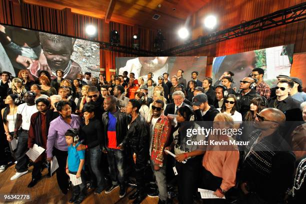 Singers and producers of "We Are The World 25 Years for Haiti" pose for a group picture following the recording session held at Jim Henson Studios on...