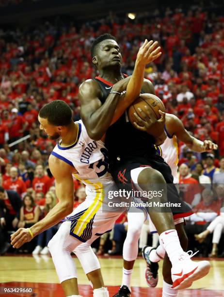 Clint Capela of the Houston Rockets goes up against Stephen Curry of the Golden State Warriors in the second quarter of Game Seven of the Western...