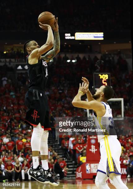 Gerald Green of the Houston Rockets shoots against Stephen Curry of the Golden State Warriors in the first half of Game Seven of the Western...
