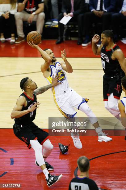 Stephen Curry of the Golden State Warriors shoots against Gerald Green of the Houston Rockets in the first half of Game Seven of the Western...