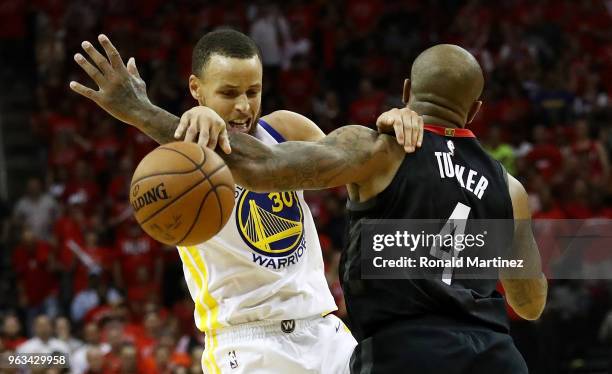 Stephen Curry of the Golden State Warriors drives against PJ Tucker of the Houston Rockets in the third quarter of Game Seven of the Western...
