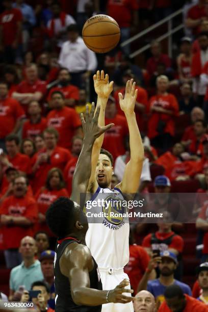 Klay Thompson of the Golden State Warriors shoots against Clint Capela of the Houston Rockets in the third quarter of Game Seven of the Western...