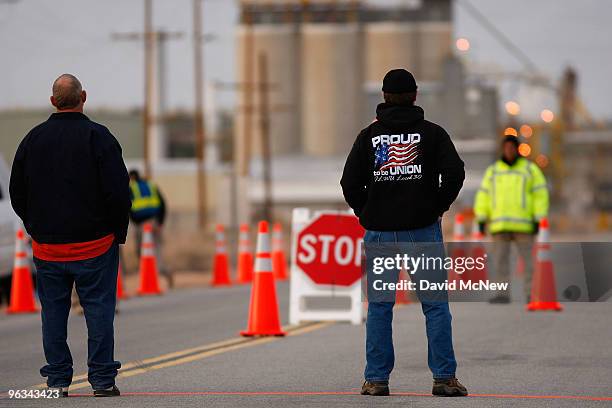 Union workers and new security guards face one another at the front gate of the Rio Tinto Borax mine on the day after mine owners locked out about...