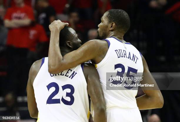 Draymond Green and Kevin Durant of the Golden State Warriors react in the fourth quarter of Game Seven of the Western Conference Finals of the 2018...