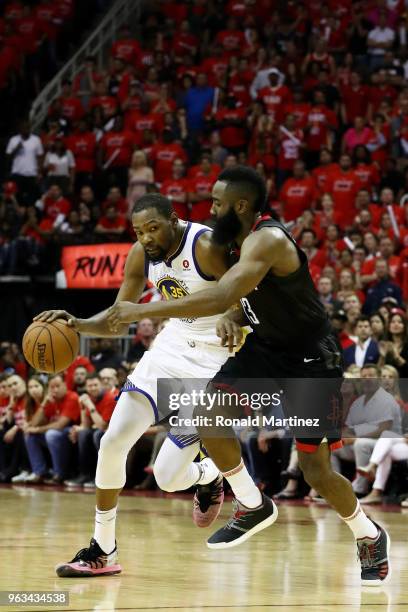 Kevin Durant of the Golden State Warriors drives against James Harden of the Houston Rockets in the fourth quarter of Game Seven of the Western...