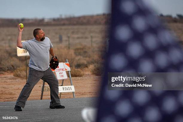 Union workers pass the time with game of catch near the front gate of the Rio Tinto Borax mine on the day after mine owners locked out about 540...