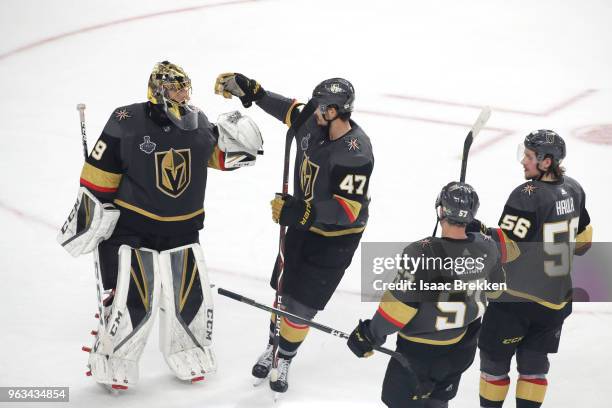 Marc-Andre Fleury of the Vegas Golden Knights celebrates his teams 6-4 win over the Washington Capitals with teammates Luca Sbisa, David Perron and...