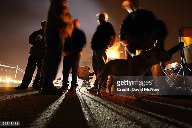 Union workers stay warm by a fire near the front gate of the Rio Tinto Borax mine on the day after mine owners locked out about 540 employees and...