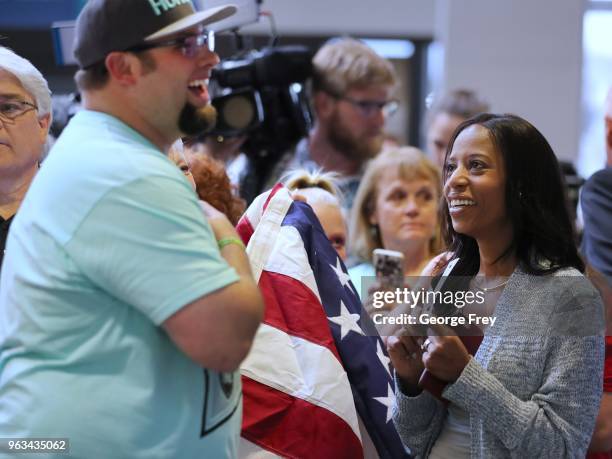 Utah Congress Woman Mia Love , talks to Derek Holt , the brother of Josh Holt, as they wait for his brother to return to Utah at the Salt Lake City...