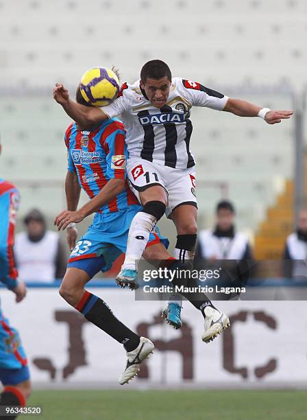 Ciro Capuano of Catania Calcio is challenged by Alexis Sanchez of Udinese Calcio during the Serie A match between Catania and Udinese at Stadio...