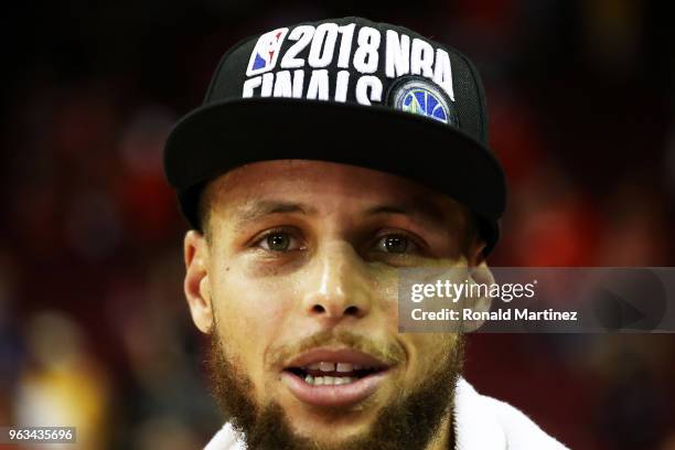 Stephen Curry of the Golden State Warriors celebrates after they defeated the Houston Rockets 101 to 92 in Game Seven of the Western Conference...