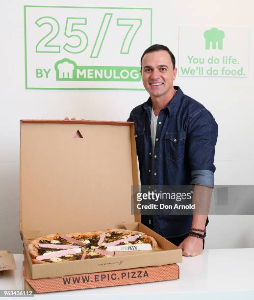 Shannon Noll poses at the launch of Menulog's 25/7 pop up store on May 29, 2018 in Sydney, Australia.