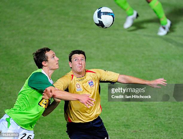 Matthew Smith of the Fury and Michael Bridges of the Jets contest the ball during the round 25 A-League match between North Queensland Fury and the...