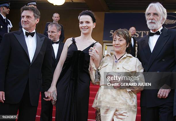 French actors Daniel Auteuil, Juliette Binoche and Annie Girardot pose for photographers with Austrian director Michael Haneke as they arrive for the...