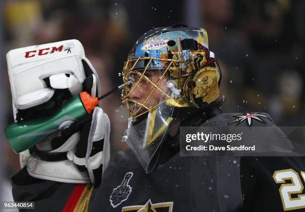 Goaltender Marc-Andre Fleury of the Vegas Golden Knights sprays water dduring warm ups before Game One of the 2018 NHL Stanley Cup Final against tthe...