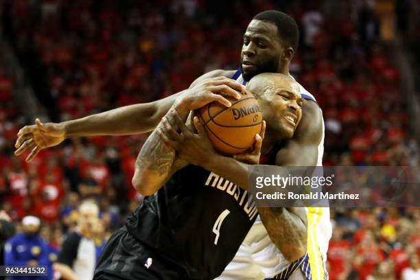 Tucker of the Houston Rockets drives against Draymond Green of the Golden State Warriors in the fourth quarter of Game Seven of the Western...