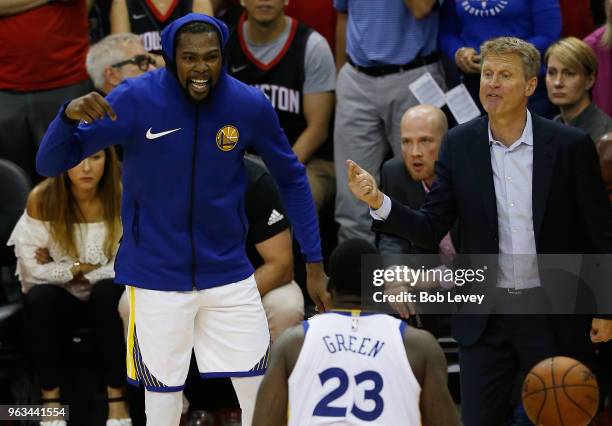 Head coach Steve Kerr, Kevin Durant and Draymond Green of the Golden State Warriors react in the fourth quarter of Game Seven of the Western...