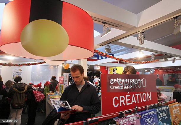 People read comic books on January 28, 2010 in Angouleme, western France, on the opening of the 37th edition of the International comic books...