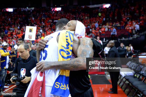 Kevin Durant of the Golden State Warriors hugs PJ Tucker of the Houston Rockets after Game Seven of the Western Conference Finals during the 2018 NBA...