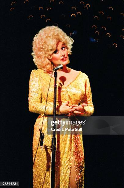 Dolly Parton performs on stage at The Dominion Theatre on March 29th, 1983 in London, United Kingdom.