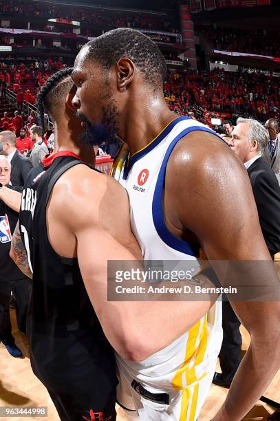 Gerald Green of the Houston Rockets and Kevin Durant of the Golden State Warriors hug after the game during Game Seven of the Western Conference...