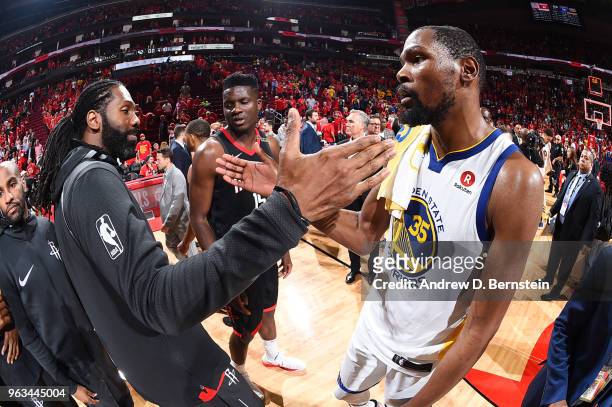 Nene Hilario of the Houston Rockets and Kevin Durant of the Golden State Warriors hug after the game during Game Seven of the Western Conference...