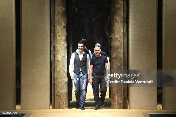Fashion designer Stefano Gabbana and Domenico Dolce acknowledge the applause of the public after the D&G show as part of Milan Menswear Fashion Week...