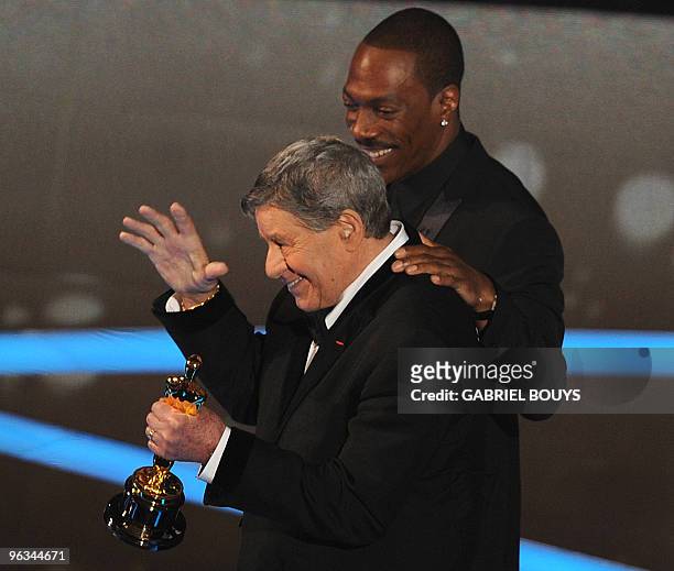 Actor Jerry Lewis leaves the stage with comedian Eddie Murphy after receiving an honorary award at the 81st Academy Awards at the Kodak Theater in...