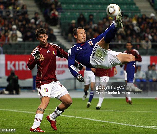 Marcus Tulio Tanaka of Japan fights for the ball during Kirin Challenge Cup Soccer match between Japan and Venezuela at Kyushu Sekiyu Dome on...