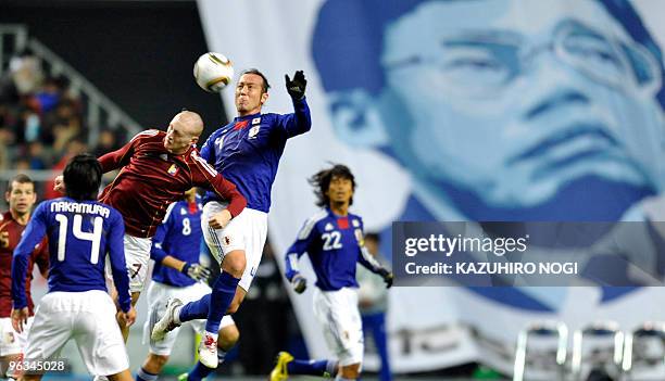 Japan's defender Tulio Tanaka Marcus fights for the ball with Venezuela's forward Fernand Aristiguieta during their international friendly match at...