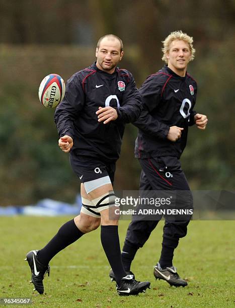 England's rugby union captain Steve Borthwick prepares to catch the ball in front of flanker Lewis Moody during a training session at Pennyhill Park...