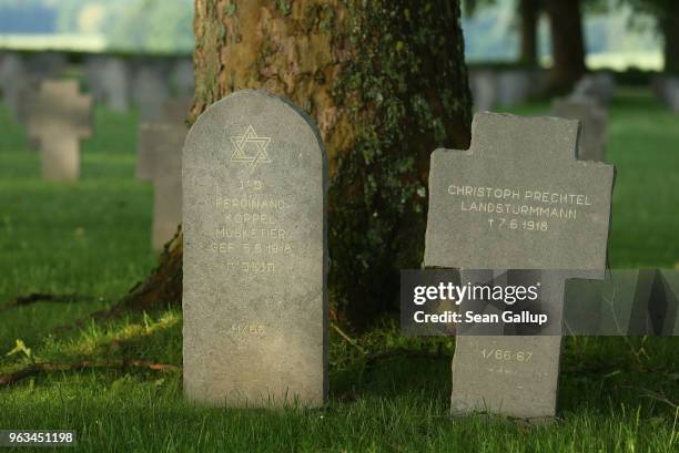 The grave of a German Jewish soldier stands among other graves in a German military cemetery that contains the remains of 8,625 German soldiers...