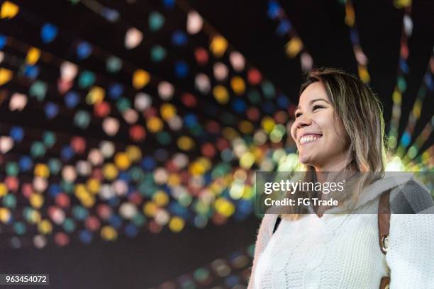 young woman enjoying a great time in the famous brazilian junina party - june festival stock pictures, royalty-free photos & images