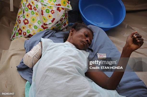 An earthquake survivor recuperates in a ward at the Medecins sans Frontieres clinic in Port-au-Prince on January 28, 2010. Desperate Haitians still...