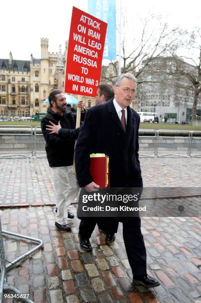Hilary Benn, the current Secretary of State for Environment, Food and Rural Affairs, is pursued by an anti-war protester as he arrives at the Queen...