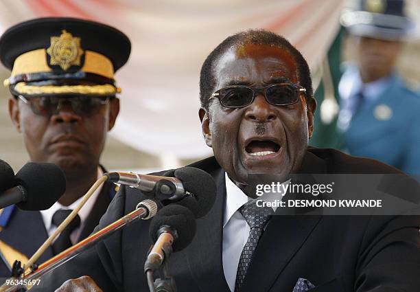 Zimbabwean President Robert Mugabe delivers a speech during the burial of Sunny Ntombiyelanga Takawira, wife of the late vice president of the...
