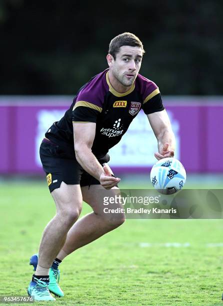 Andrew McCullough passes the ball during a Queensland Maroons State of Origin training session on May 29, 2018 in Brisbane, Australia.